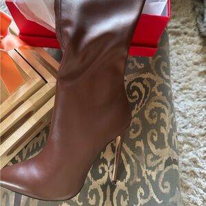 Thigh high leather boots, brown and new, never worn.